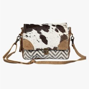 Myra Bag 
Cowhide messenger canvas bag